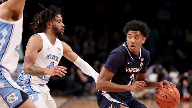 Virginia Cavaliers guard Reece Beekman and North Carolina Tar Heels guard R.J. Davis